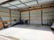 Spacious three-car garage with ample storage and work space at 160 E Elm St, Morgantown, IN 46160