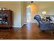 Hallway showcasing hardwood floors and an archway that leads to the living room at 160 E Elm St, Morgantown, IN 46160