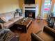 Inviting living room showcasing a fireplace, hardwood floors, and comfortable seating at 160 E Elm St, Morgantown, IN 46160