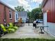 Back patio with furniture and BBQ grill, perfect for outdoor entertaining at 160 E Elm St, Morgantown, IN 46160