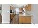 Modern kitchen featuring stainless steel appliances, light wood cabinets, and a spacious countertop at 1702 Juniper Ln, Greenwood, IN 46143