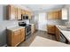 Bright kitchen featuring stainless steel appliances and wooden cabinets at 1702 Juniper Ln, Greenwood, IN 46143