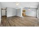 Open-concept living room featuring neutral paint, wood floors, and vaulted ceiling at 1702 Juniper Ln, Greenwood, IN 46143