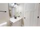 Bathroom vanity with white counter, white sink, and dark hardware at 1809 S H St, Elwood, IN 46036