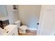 Stylish half bathroom featuring modern fixtures, toilet, sink and vanity at 1809 S H St, Elwood, IN 46036