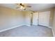 Bedroom with gray carpet, closet, ceiling fan, and neutral walls at 1809 S H St, Elwood, IN 46036