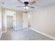 Bedroom with gray carpet, closet, ceiling fan, and neutral walls at 1809 S H St, Elwood, IN 46036