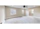 Spacious carpeted bedroom with natural light, offering flexibility for various furniture arrangements at 1809 S H St, Elwood, IN 46036