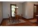 Well-lit dining room with wooden floors, a chandelier, and a view of a window at 189 S Jefferson St, Martinsville, IN 46151