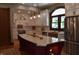 Bright kitchen with a large island, custom cabinets, granite countertops, stainless appliances, and hardwood floors at 189 S Jefferson St, Martinsville, IN 46151