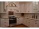 Gourmet kitchen with custom white cabinetry, granite counters, and stainless steel appliances at 189 S Jefferson St, Martinsville, IN 46151