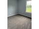 An empty bedroom showcases ample natural light and neutral carpet at 19236 Fox Chase Dr, Noblesville, IN 46062