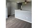 Carpeted hallway featuring a ceiling fan, white doors and access to other areas at 19236 Fox Chase Dr, Noblesville, IN 46062
