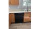 Sink and dishwasher with wood cabinets and white countertop at 19236 Fox Chase Dr, Noblesville, IN 46062