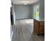 Spacious living room with wood-look floors and sliding glass doors to the backyard at 19236 Fox Chase Dr, Noblesville, IN 46062