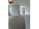 Grey living room with carpet, grey walls, and white trim throughout at 19236 Fox Chase Dr, Noblesville, IN 46062