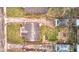 Aerial view of the house showing its roof, yard, and surrounding neighborhood at 1940 N Drexel Ave, Indianapolis, IN 46218