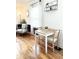 Cozy dining area featuring hardwood floors, ample natural light, and a table for two at 1940 N Drexel Ave, Indianapolis, IN 46218