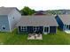 Aerial view of the backyard, showcasing the patio, surrounding green space, and the home's exterior at 1980 Bridlewood Dr, Franklin, IN 46131