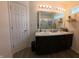 Modern bathroom with double sinks and a large mirror, perfect for shared use and enhanced grooming at 1980 Bridlewood Dr, Franklin, IN 46131