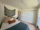 Comfortable bedroom with a decorative tapestry, featuring soft, inviting bedding and a peaceful atmosphere at 1980 Bridlewood Dr, Franklin, IN 46131