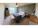 Comfortable bedroom with a modern accent wall, plush carpeting, and plenty of natural light at 1980 Bridlewood Dr, Franklin, IN 46131
