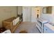 Bright Bedroom with a crib and changing table, designed for a functional and organized baby care area at 1980 Bridlewood Dr, Franklin, IN 46131