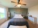 Inviting bedroom with a stylish accent wall, comfortable bed, and plenty of natural light at 1980 Bridlewood Dr, Franklin, IN 46131