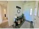 Welcoming entryway with stylish decor, including a console table and a mirror, creating a pleasant first impression at 1980 Bridlewood Dr, Franklin, IN 46131