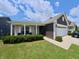 Charming home with brick accents, a welcoming porch, and well-maintained landscaping at 1980 Bridlewood Dr, Franklin, IN 46131
