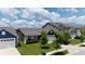 Street view of homes with landscaped front yards and attached garages, highlighting curb appeal at 1980 Bridlewood Dr, Franklin, IN 46131