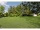 Expansive backyard with a lush lawn and scattered trees, ideal for outdoor activities at 20797 Roberts Dr, Sheridan, IN 46069