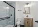 Modern bathroom featuring a glass shower, updated vanity, and matte black fixtures at 20797 Roberts Dr, Sheridan, IN 46069