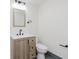 Modern bathroom with a wood vanity, a stylish sink, and modern fixtures at 20797 Roberts Dr, Sheridan, IN 46069
