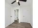 Bright bedroom featuring wood-look flooring, a ceiling fan, and access to an adjacent room at 20797 Roberts Dr, Sheridan, IN 46069