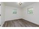 A cozy bedroom with wood-look flooring and natural light at 20797 Roberts Dr, Sheridan, IN 46069