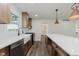 Beautiful kitchen featuring modern white counters, stainless steel appliances, and modern lighting at 20797 Roberts Dr, Sheridan, IN 46069