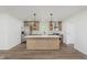 Bright open kitchen with stainless steel appliances, white countertops, and a large center island at 20797 Roberts Dr, Sheridan, IN 46069