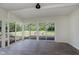 Bright sunroom with neutral walls and natural light streaming in from the windows and sliding glass doors at 20797 Roberts Dr, Sheridan, IN 46069
