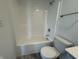 Clean bathroom showcasing a shower-tub combo, toilet, and partial vanity, designed for comfort and functionality at 2954 Grand Rdg Dr, Greenwood, IN 46143