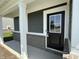Close-up of a welcoming front door with a glass window and a stylish brick facade, adding curb appeal at 2954 Grand Rdg Dr, Greenwood, IN 46143