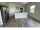 Bright, modern kitchen with an island, stainless steel appliances, and sleek cabinetry, creating a stylish cooking space at 2954 Grand Rdg Dr, Greenwood, IN 46143