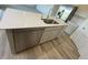 Modern kitchen island with stainless steel dishwasher and sink with plenty of prep space on the stylish countertop at 2954 Grand Rdg Dr, Greenwood, IN 46143
