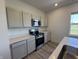 Modern kitchen featuring stainless steel appliances, sleek countertops, and ample cabinet space for convenient storage at 2954 Grand Rdg Dr, Greenwood, IN 46143