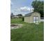 The backyard has a shed and a fire pit at 3038 S Richardt Ave, Indianapolis, IN 46239