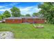 Brick house with a spacious backyard and mature trees at 3038 S Richardt Ave, Indianapolis, IN 46239
