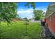 Well-maintained backyard featuring a storage shed, garden bed, and plenty of open space at 3038 S Richardt Ave, Indianapolis, IN 46239