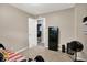 Bedroom with carpet and an open door to the hall at 3038 S Richardt Ave, Indianapolis, IN 46239