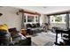 Warm living room with comfortable couches, vinyl floors, and natural light at 3038 S Richardt Ave, Indianapolis, IN 46239