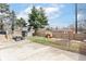 The backyard has a concrete patio area, a small playground, and a garden area at 3147 Bonham Dr, Indianapolis, IN 46222